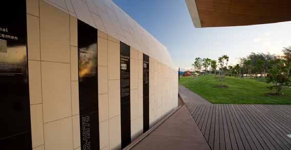 The War Memorial Wall with its rusticated steel and white tile cladding is designed as a large scale Monument ; a symbol of solidity and strength, onto which the contrasting black panels provide