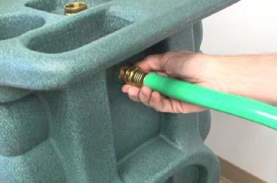 6. Optional Auto Pump-out System - Connection of Pump-out Hose: The pump-out hose is a 50 section of 3/4 garden hose. Remove the cap from the pump-out outlet fitting on the back of the machine.