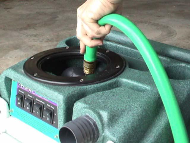 The Hydro-Filter must be examined and cleaned regularly to keep the M200H functioning properly: Push the latch lever and open the Hydro-Filter lid. Remove the filter bag.