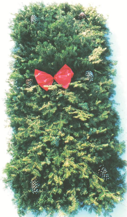 Swag is decorated with a large weatherproof red ribbon and pine