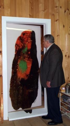 ARTIST DENNIS WHEELER OPENING A DOOR