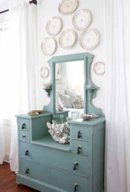 Blue Sky Day Original knobs adorn an old blue dresser, above, in Diane s master bedroom. Why hide pretty plates?