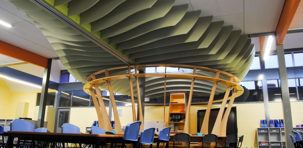CREATIVE SOLUTIONS FOR INNOVATIVE LEARNING ENVIRONMENTS CUSTOM ACOUSTIC DESIGN The unique Cube TM ceiling fin system controls noise reverberation at St James The Apostle School library.