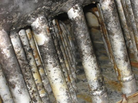 2) Corrosion of Tubes, Fins or Connections Inspect the surface of the tubes, fins, and piping connections for signs of pitting or uneven discoloration.