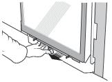 Apply firm hand pressure around the window frame to ensure the window is sealed tight against the firebox.