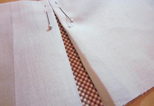 4. Transfer to your ironing board to press in place. Then, transfer to your sewing machine to baste the raw edges.