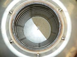 protection disc through the opening in the heat exchanger; Fig.