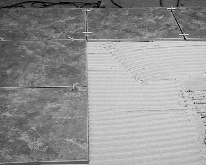 One-Step Method: Apply a thick layer (5-10mm) of flexible tile adhesive directly onto the heating mats and factory joint ensuring even coverage. Lay the tiles directly onto the adhesive layer. 2.