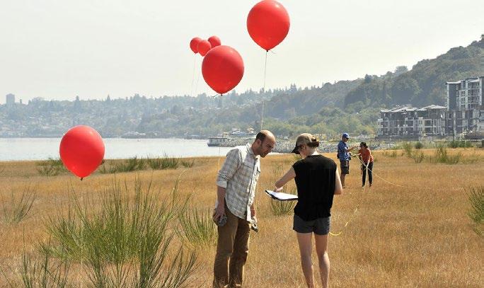 Balloons are used to mark topography of a future 11- acre park on the peninsula at Point Defiance (left) Citizens attend an open house to look over the draft update to the Point Defiance Park Master