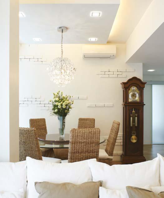 The cosiness and warmth of the dining area courtesy of the rattan dining set and grandfather s clock gets a surprising glamorous touch via the intricately designed chandelier and the recessed