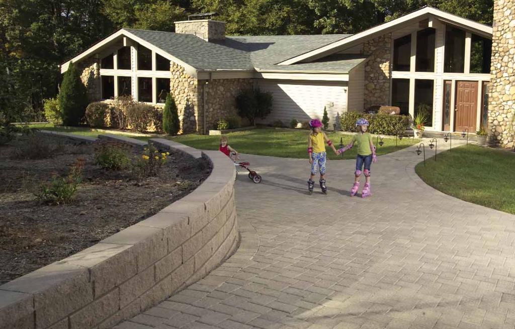 Create a driveway entrance with decorative light fixtures or add additional columns for lead-ins to other areas of the landscape.