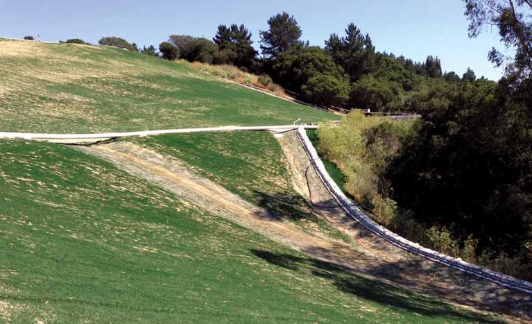FIGURE 7 Confluence of drainage channels at the Crazy Horse Landfill outlet. Tensile tests were conducted on artificial grass samples from a field test location near Phoenix, Ariz.