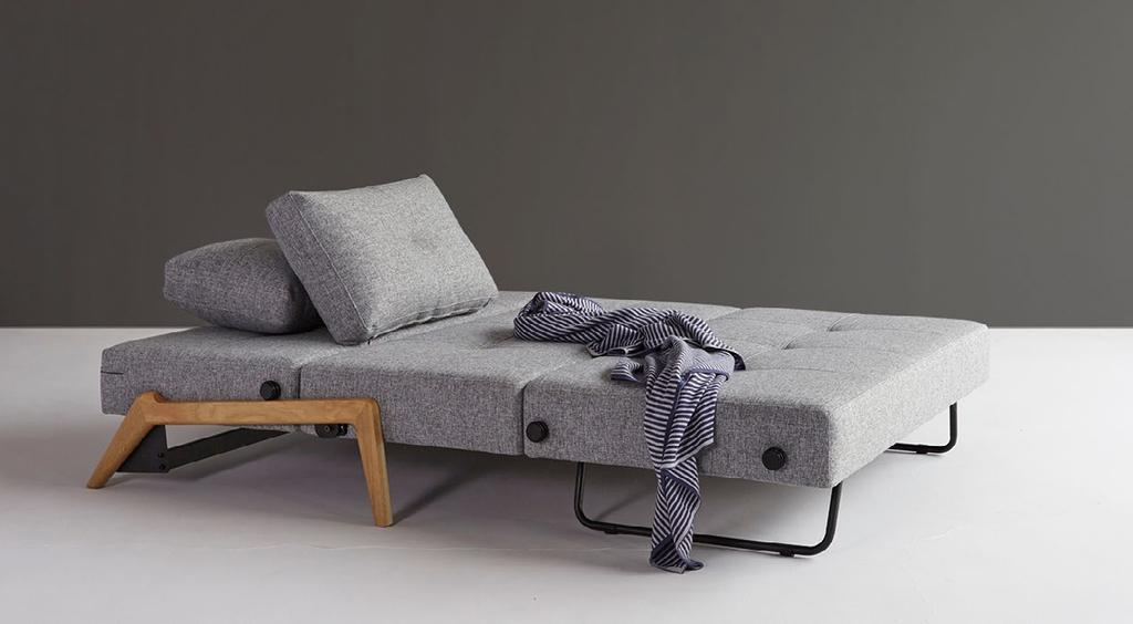 Cubed sofa easily unfolds to make up a 140 x 200 cm bed, and the bedding box fits a couple of small cushions