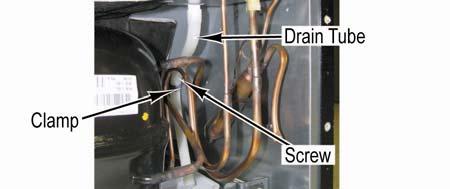 Compressor Removal Access to Machine Compartment 1. Remove bale strap which retains overload/relay/capacitor. 2. Pull overload/relay/capacitor assembly off of compressor terminals. 3.