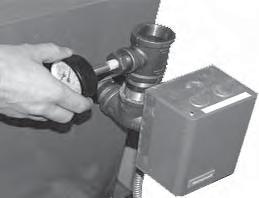 2. Apply pipe sealant to the threads on the shaft of the gauge as shown in Figure 7.