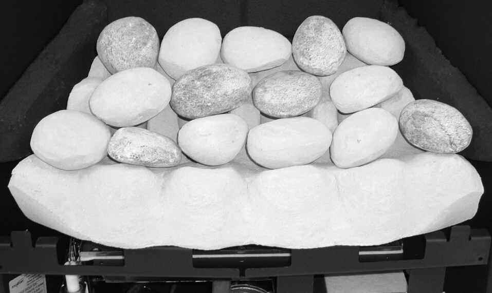 Figure 15 Figure 14 Place the middle row of four pebbles onto the supports in the matrix, over the top of the holes.