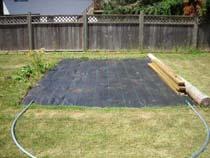 Here is a picture of the ground cover. See an assembled 10 wide hoop lying out in front.