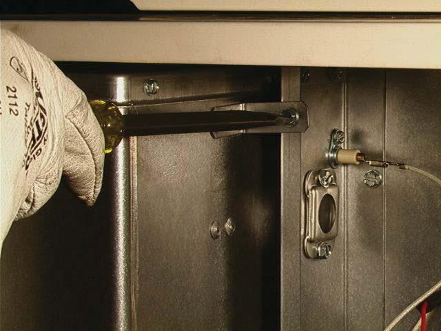 Figure 13a b) Holding the venturi tube, slide the entire burner slightly to the right to disengage the