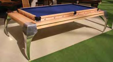 In a single action the dining table rolls over to be replaced by a perfectly level playing surface at the correct, raised, height.