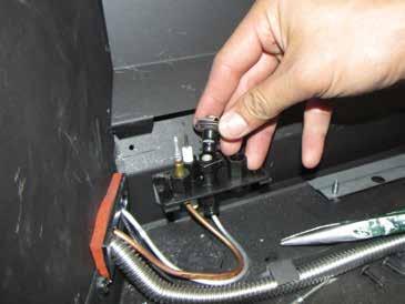 From inside the fi rebox, remove pilot retainer clip with pliers and pull off the pilot cap to