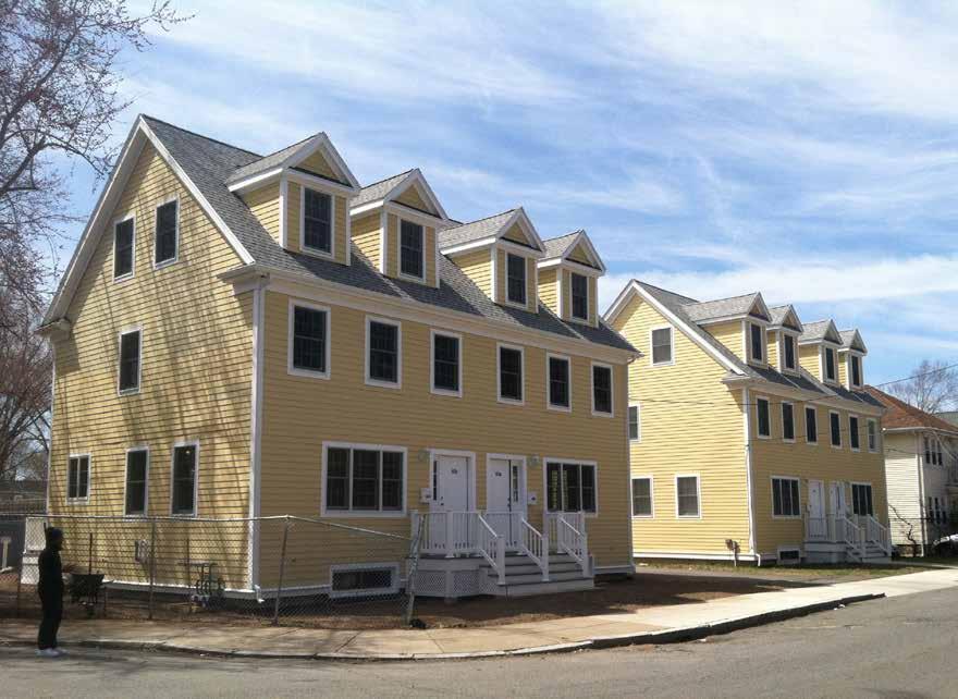 Two buildings are complete, each with two townhouse-style units measuring approximately 1,400 square feet each. Three Habitat families have already moved into their new homes.