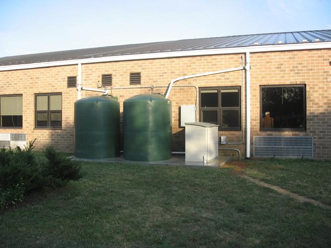 Slide 50 Rainwater harvesting Larger-scale rainwater harvesting at school Photo: Rutgers Water Resources Program This photo shows a larger-scale water harvesting system at a school.