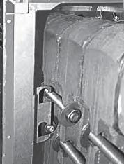 Attach top/front intermediate panel to lower base brackets through four slotted holes in panel.