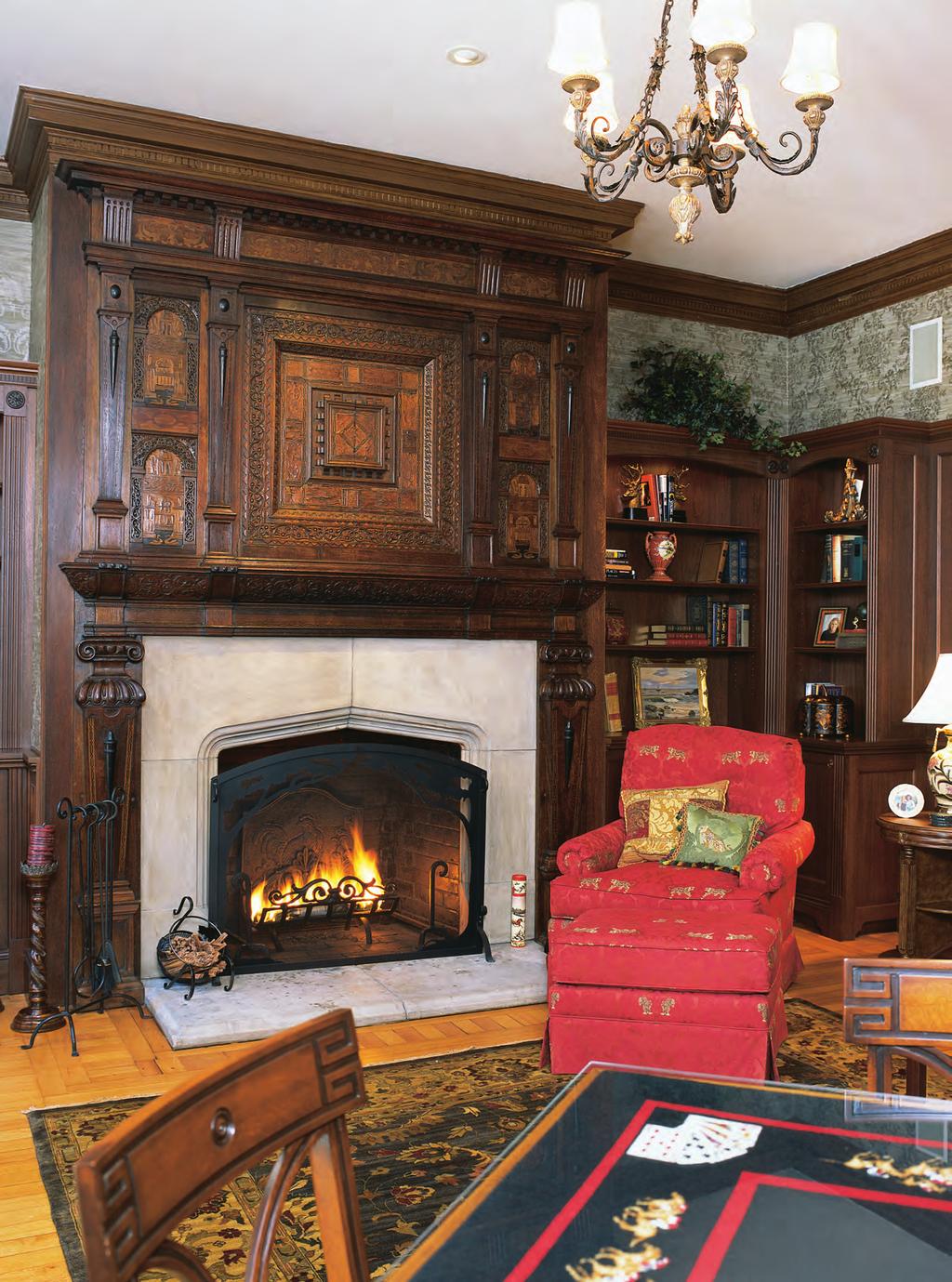 WARM AND RICH An ornate mantel of inlaid chestnut and ebony wood looks over a tobacco-colored leather sofa and