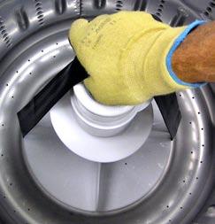 To level the washer, tilt the washer forward to lift the rear legs off the floor, then gently set it back down.