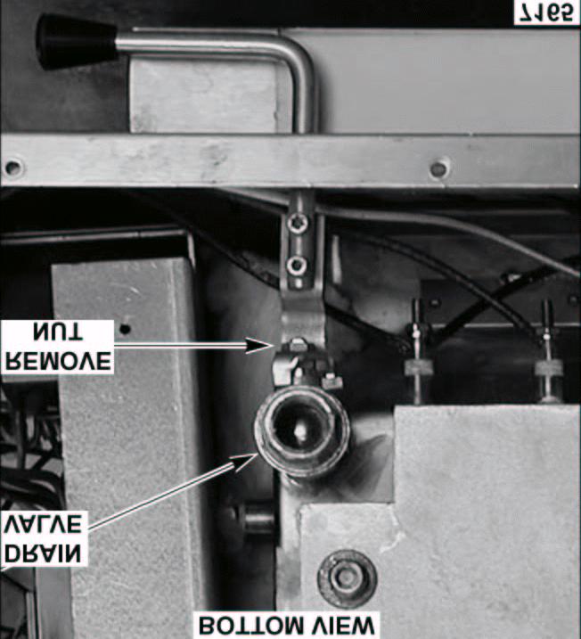 MANUAL DRAIN VALVE WARNING: DISCONNECT THE ELECTRICAL POWER TO THE MACHINE AT THE MAIN CIRCUIT BOX. PLACE A TAG ON THE CIRCUIT BOX INDICATING THE CIRCUIT IS BEING SERVICED. 1.