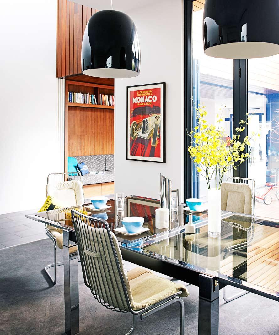 real homes Retro dining Original chrome 1960s chairs paired with a sleek glass dining table imbue a retro feel in the dining room, while the black pendants add a real sense of drama to the space.