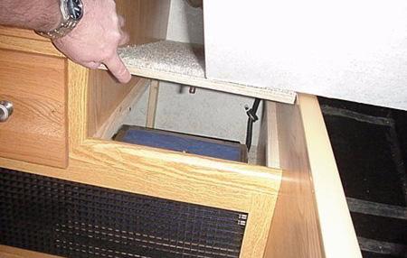 .. a finger hole is provided near the middle of the panel for liftout removal).