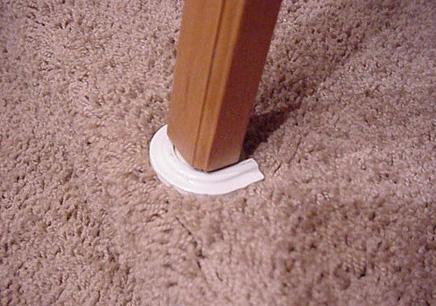 Make sure that the table leg is secured into the floor support bracket and the leg