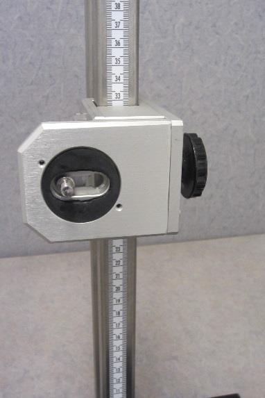 The camera stand can be lowered or raised with the turn of a knob. Camera can be adjusted to the front or back with the turn of a knob.