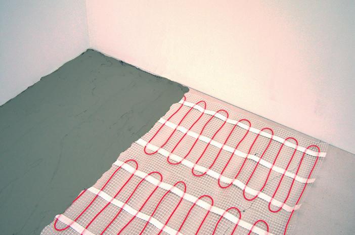 (DO NOT SPOT TILE!). Press down the tile with a light sliding motion. 10. Self-Levelling method: Unroll the heating mat with the heating cable facing upwards.