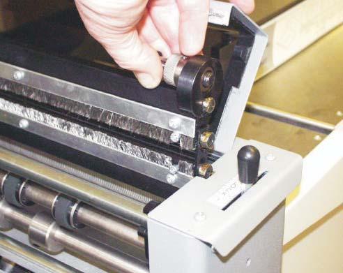 DocuMaster MK3 Replacing Blade Set FIG 21.1 11. Push the exit guard down and replace the stacker assembly before operating the machine. 12. Switch the machine on and test the crease for form.