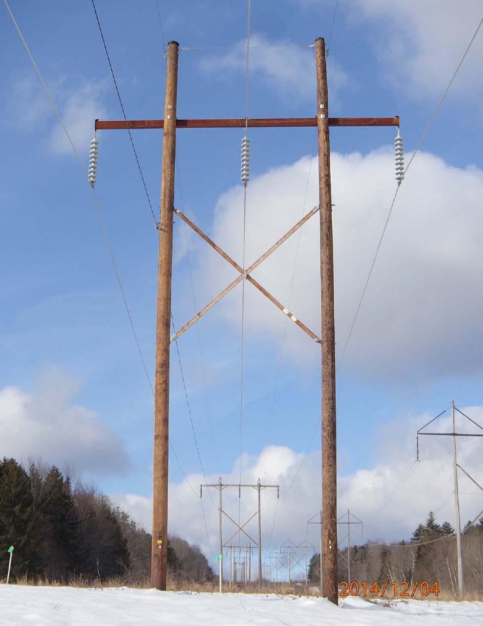 Aesthetic Analysis Report Figure 4: View of recent 115 kv replacement structure in foreground, with an existing structure similar to those on the K31 line in the background.