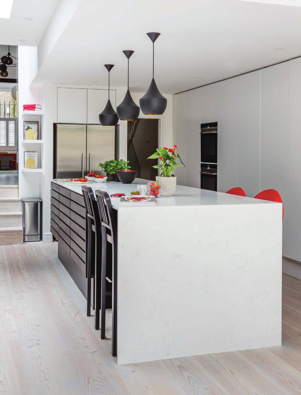 The Multiform Form 1 island is the centre piece of this room. Dramatically contrasting against the crisp white cabinetry and light, bright surroundings, the island features black stained oak doors.