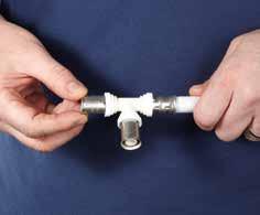 Do a final check to ensure that the pipe is still inserted fully into the fitting, then using the white washer as a location point fix the jaws over the fitting in the un-pressed condition.