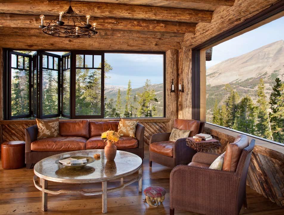 Above: Putting a contemporary twist on the classic Adirondack screened-in porch, the Lone Peak porch features accordion windows that open to the majestic views of the surrounding mountains. solution.