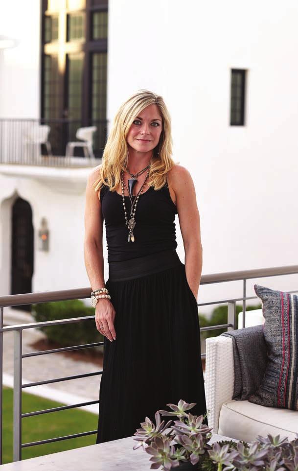 above Mandy Mayers, co-owner of Interior Philosophy, stands on the second story of her Alys Beach home.