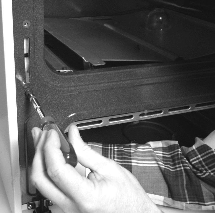 The drawer glide rail and drawer shield can be removed together by pulling straight forward. Remove hinge receptacle 1.