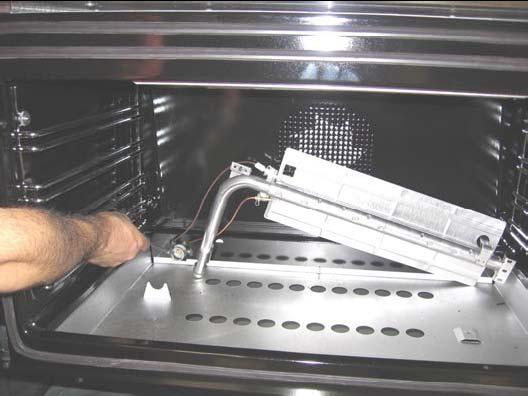 Loosen the screw located on the right side of the burner and pull