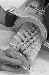 The cylindrical brushes should be replaced if large amounts of bristles are missing, or if the remaining bristle length is less than 15 mm (0.62 in). NOTE: Replace worn brushes in pairs.