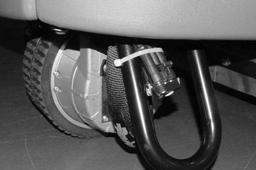 To disengage the brake, insert the tip of a small screw driver between the electronic brake lever and the hub.