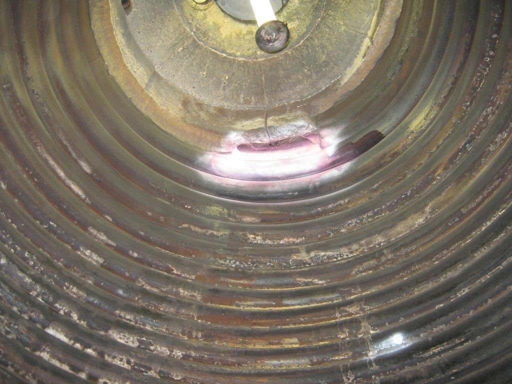 Refractory coil insulation Figure 7: Photograph of internal view of a similar thermal oil heater furnace roof showing original refractory 1.