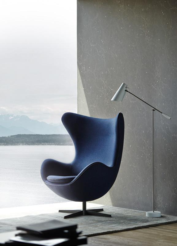 LAMINATE OSSIDI LIMESTONE DXN 5328D Arne Jacobsen limited-edition egg chair, and Birdy floor lamp, both from Danish Design.