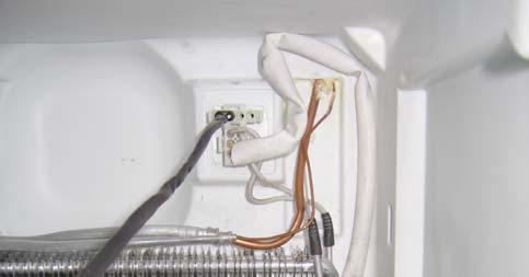 To remove the cover of the freezer compartment air return vent simply insert a