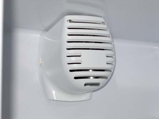 Remove the refrigerator fan cover by pressing