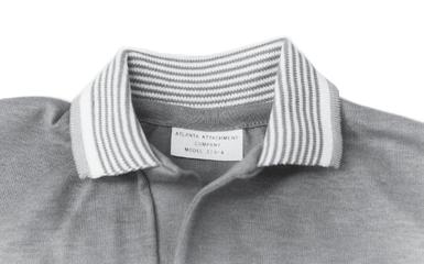 The tape does not extend to the edge of the placket on either end. Therefore, when the placket is turned, there is no bulk or additional thickness.